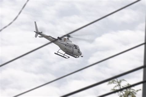 KOJC members accused of pointing laser at choppers .